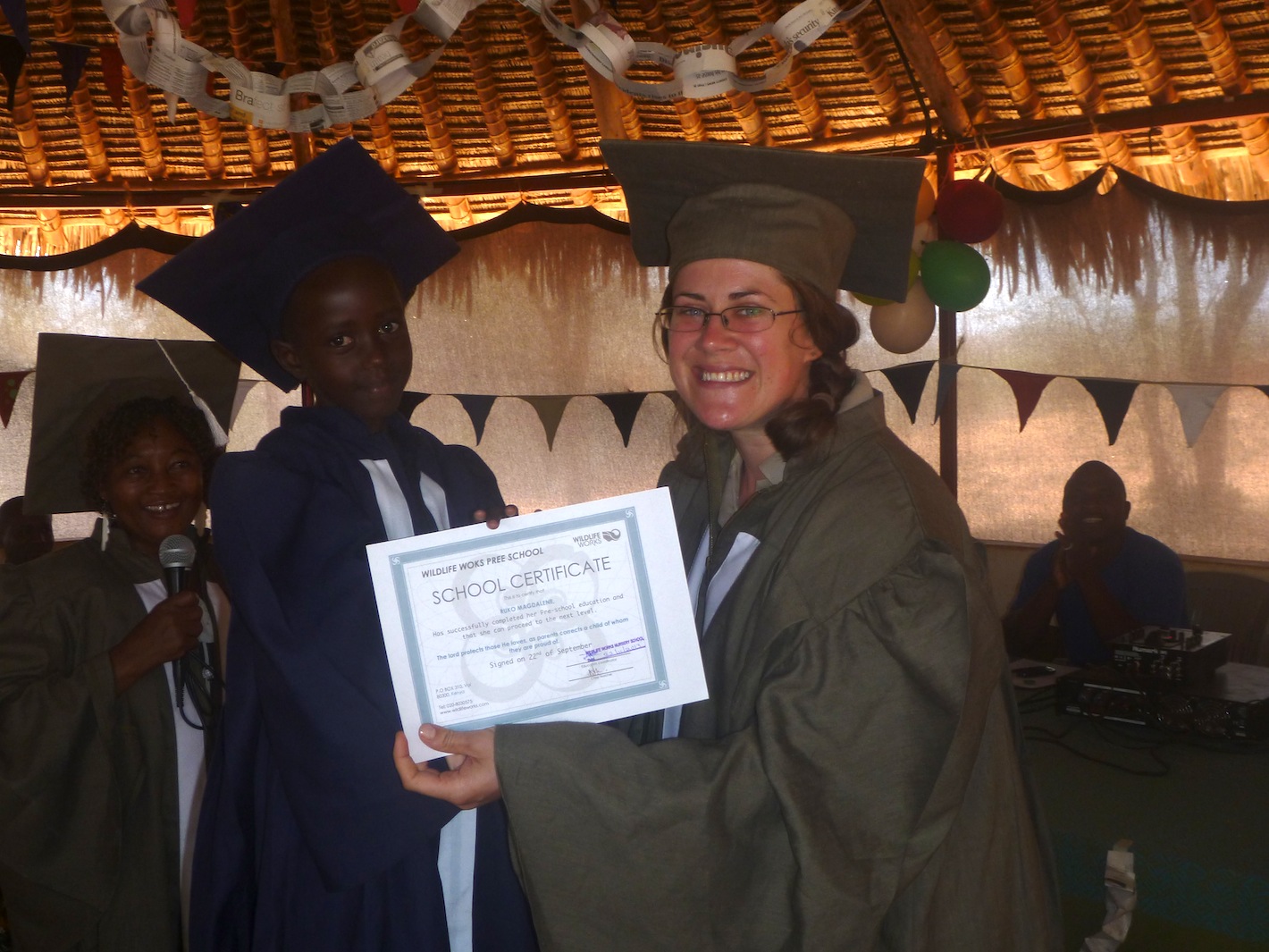 A graduating student receives a certificate