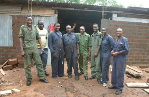 Paul Makau Mwanzia and his Wildlife Works' Auto shop team